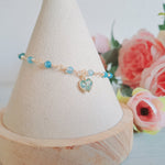 Fiorella corazón cristal celeste